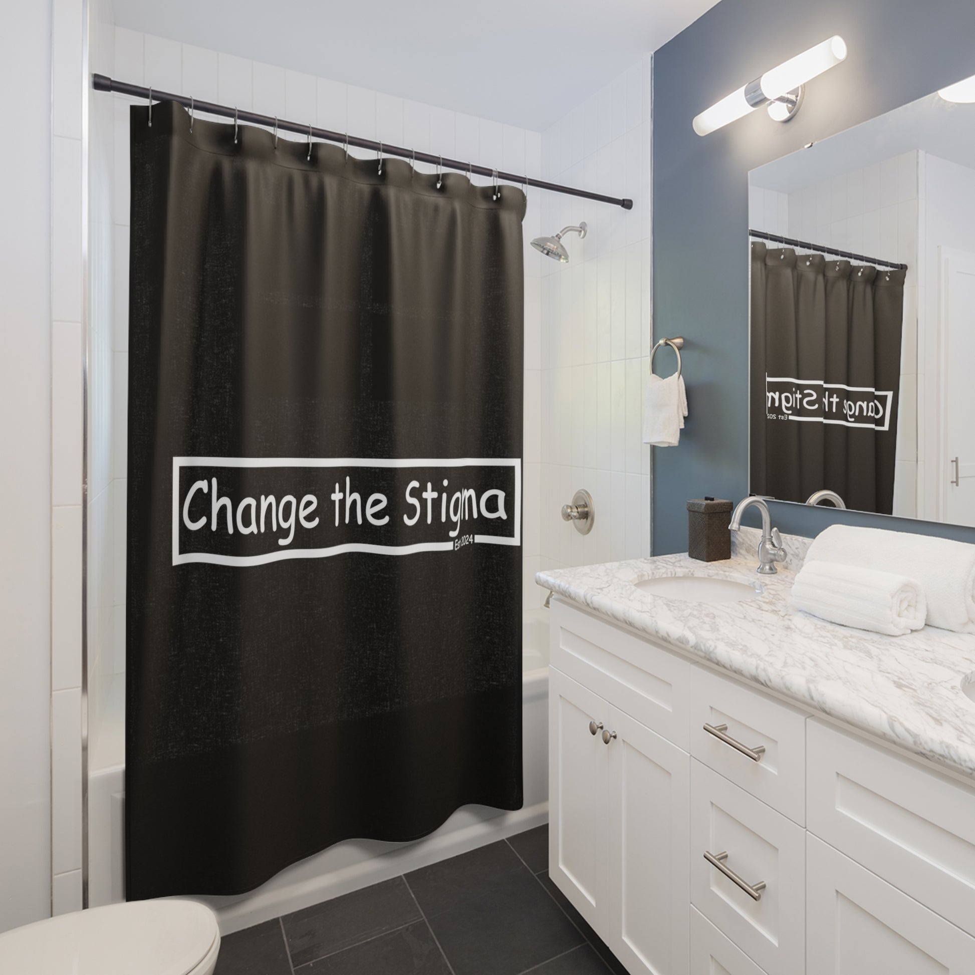 71"x74" Black shower curtain, front side in a bathroom, shows the words "Change the Stigma".