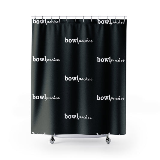 Black shower curtain which displays "bowl packer". This is shown with a front view. 